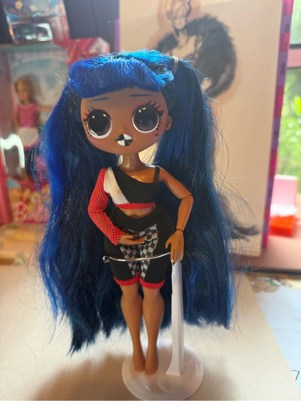L.O.L. Doll with Vibrant Blue Hair and Black-Red Outfit